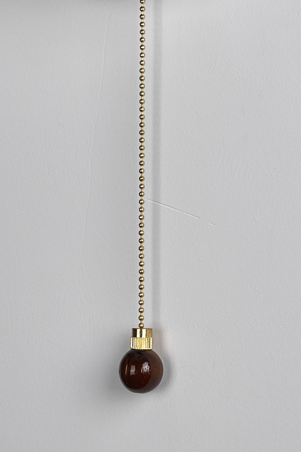Rounded Walnut & Glass Wall Sconce close-up showing pull-chain connection and wooden end piece