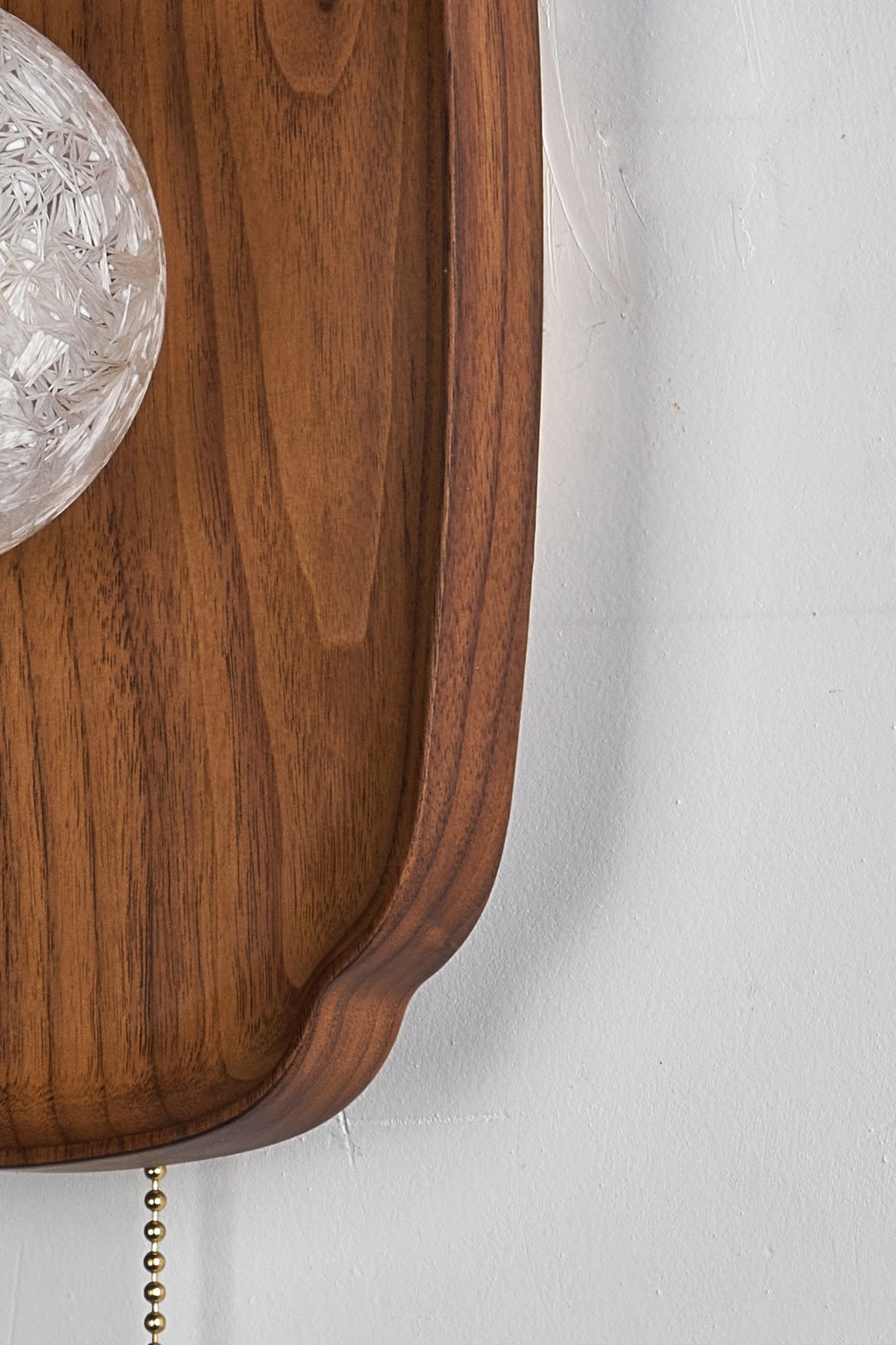 Natural walnut grain and carved backplate edge