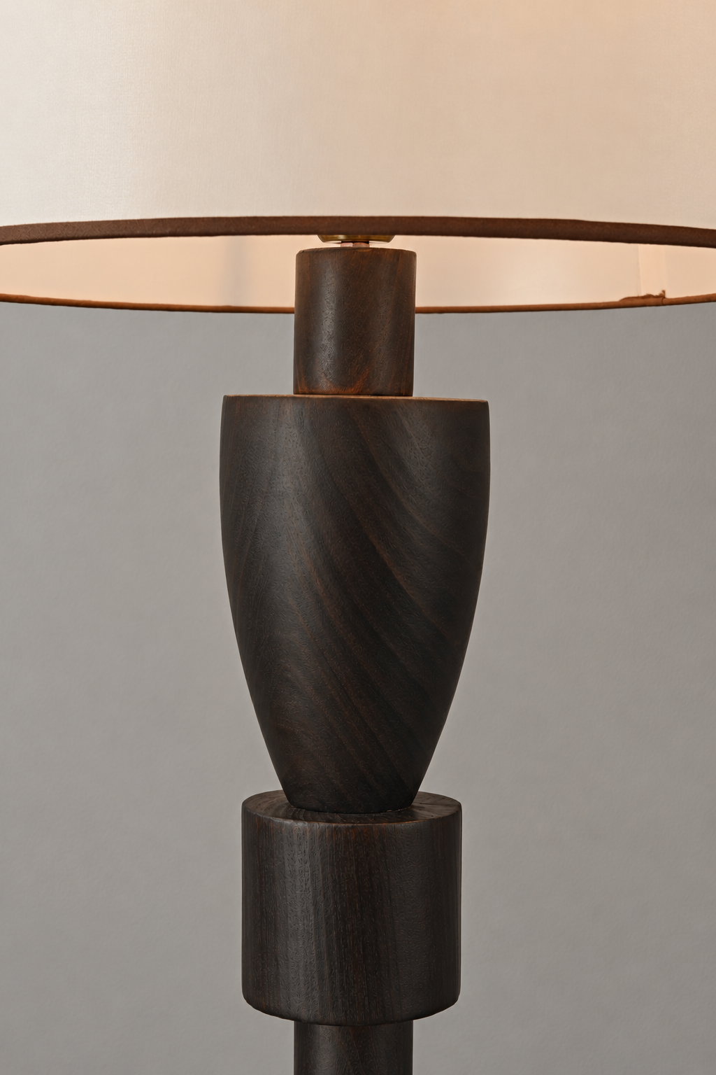 Close-up of the camphor wood upper body and fabric shade connection