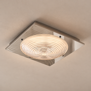 Concentric clear glass ceiling light with a square mirrored steel plate, illuminated