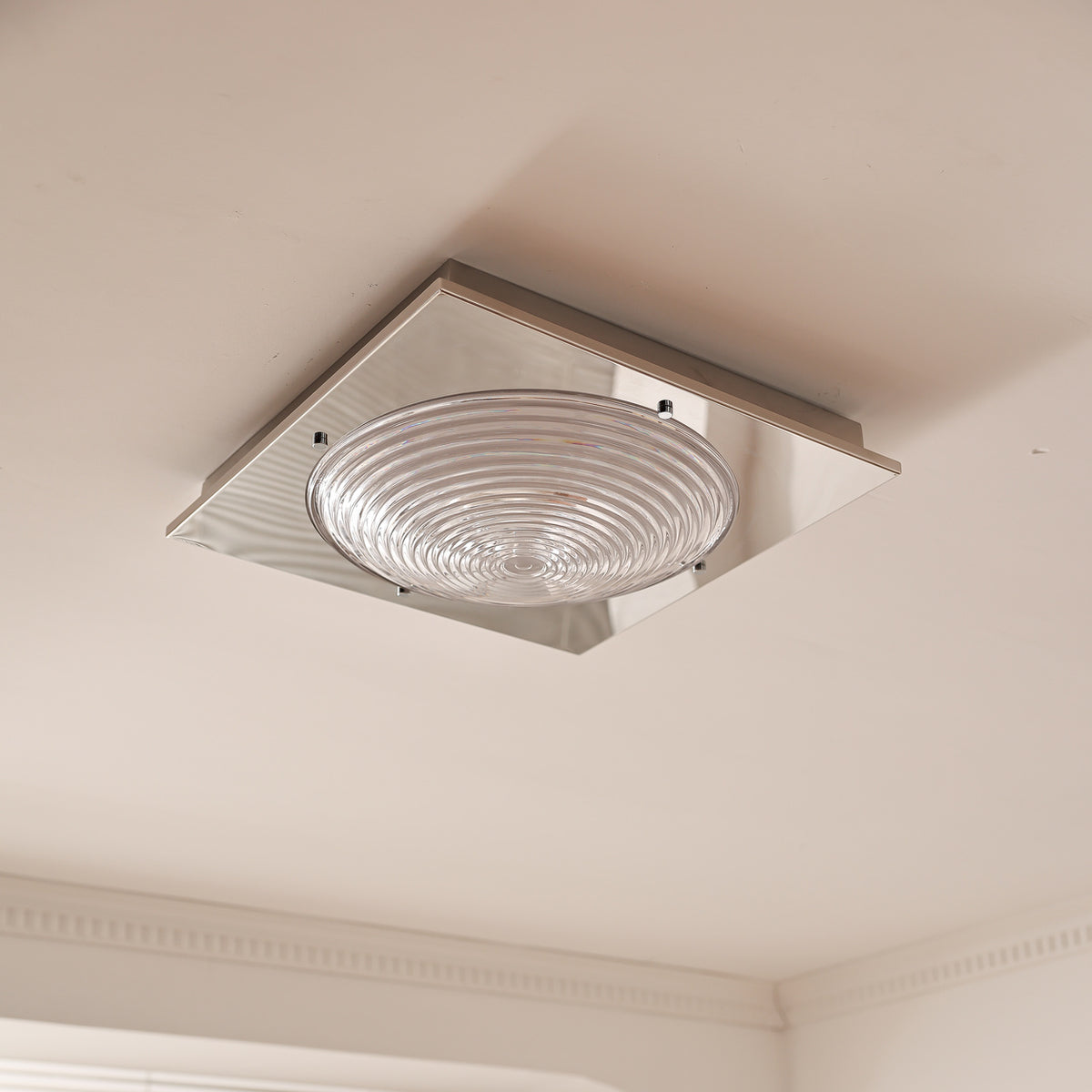 Real installed clear-glass ceiling light, switched off