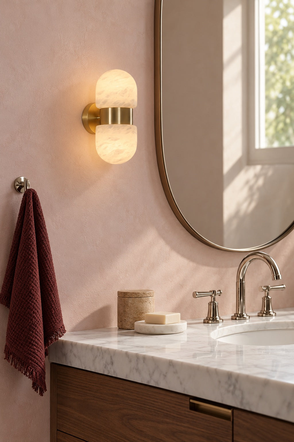 Alabaster Double Capsule Wall Sconce — Natural copper sconce above a dressing table