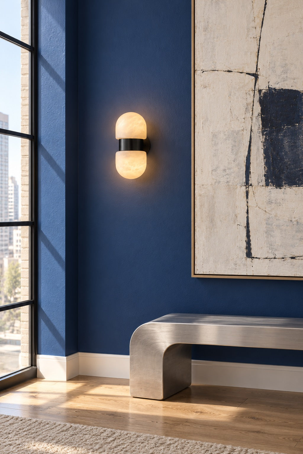 Alabaster Double Capsule Wall Sconce — Black sconce on an art gallery wall