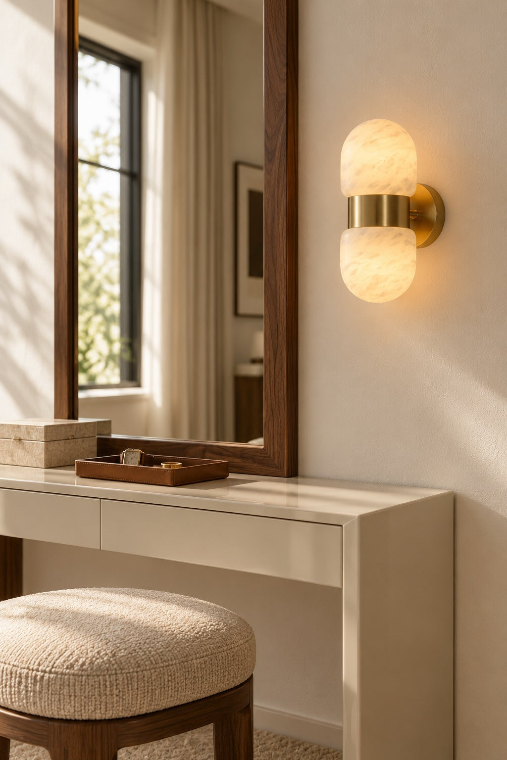 Alabaster Double Capsule Wall Sconce — Natural copper sconce in a dressing area