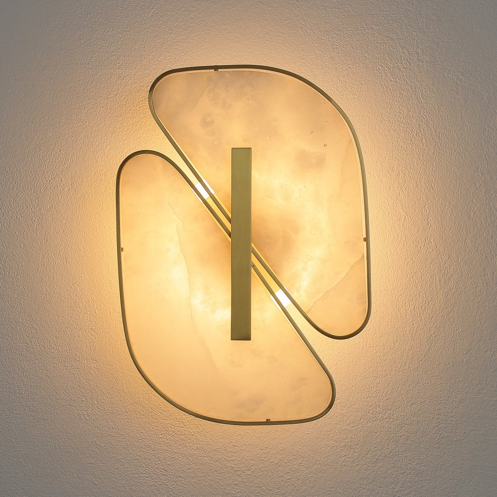 Front view of the illuminated double-petal alabaster wall sconce
