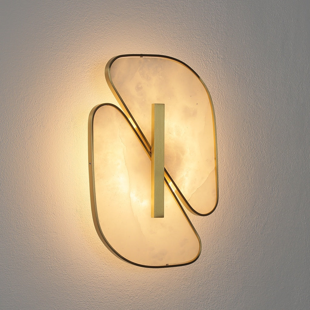 Three-quarter view of the illuminated alabaster wall sconce