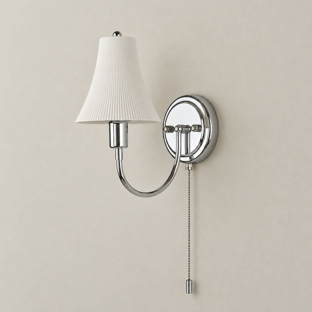 Fluted white ceramic bell wall sconce in polished chrome, unlit, with complete pull-chain switch