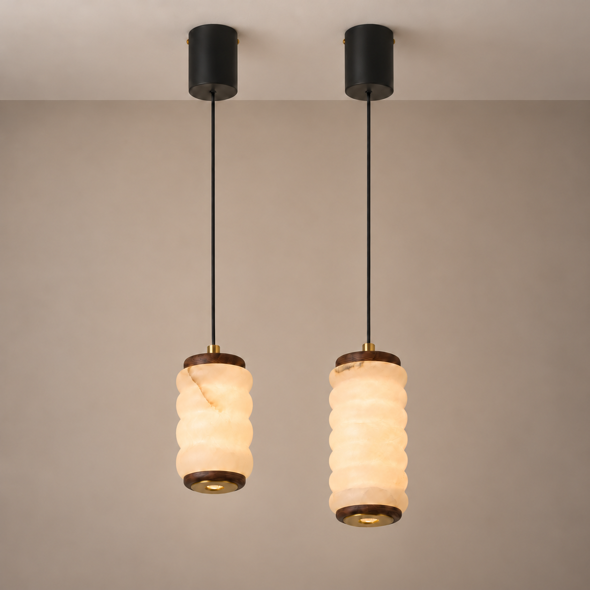 Ruvellune small and large stone pendants side by side with long suspension cords; each pendant sold separately.