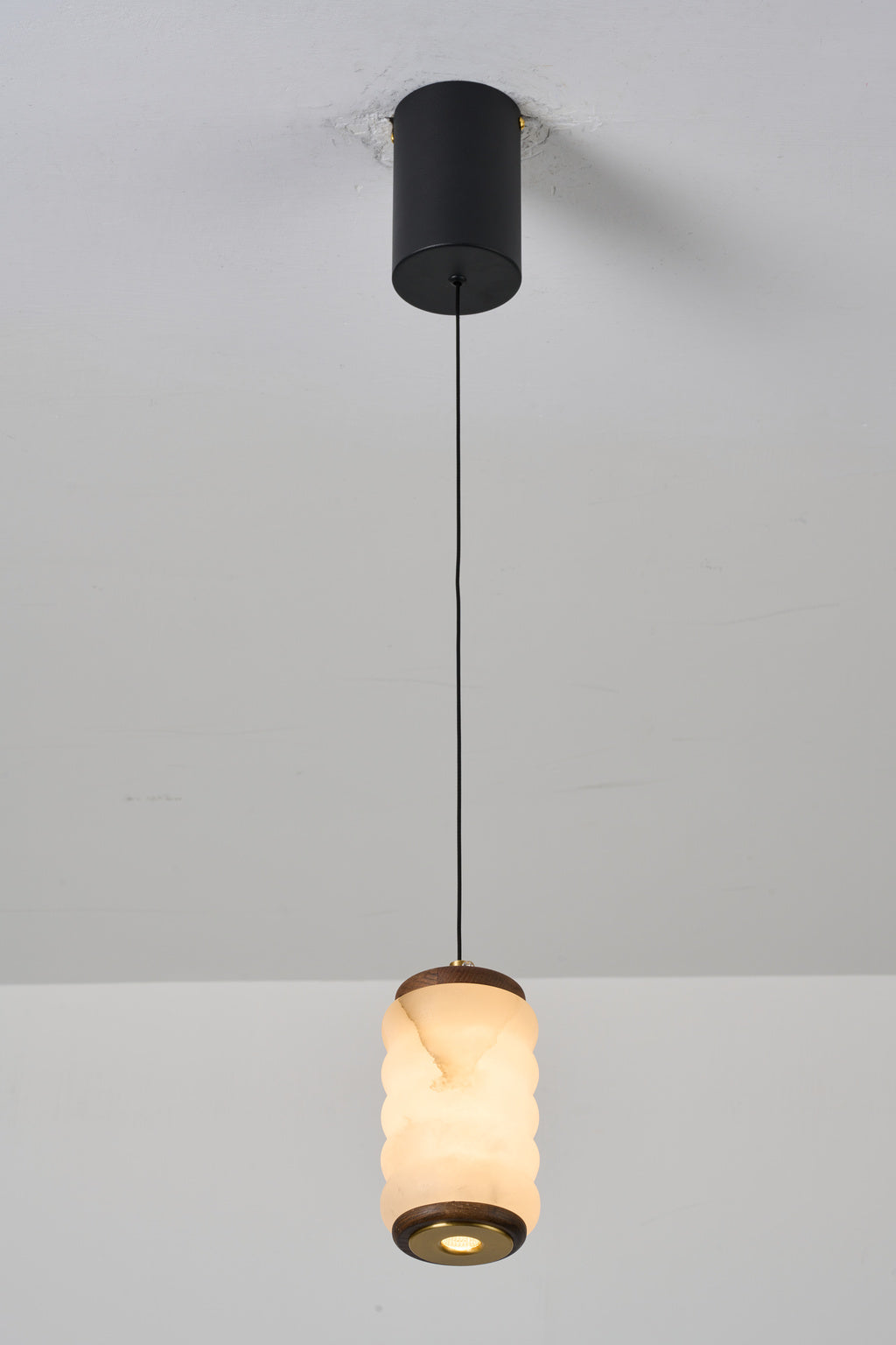 Ruvellune small pendant — real installed lower view, switched on