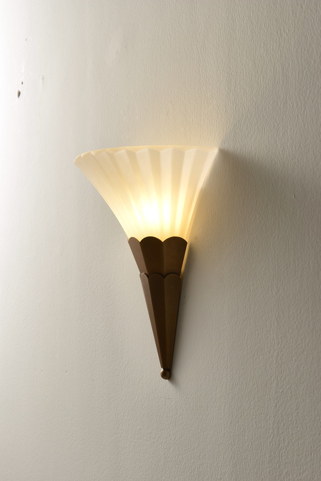 Fanelisse fluted glass wall sconce in Antique Bronze - One-tier actual side view, warm light