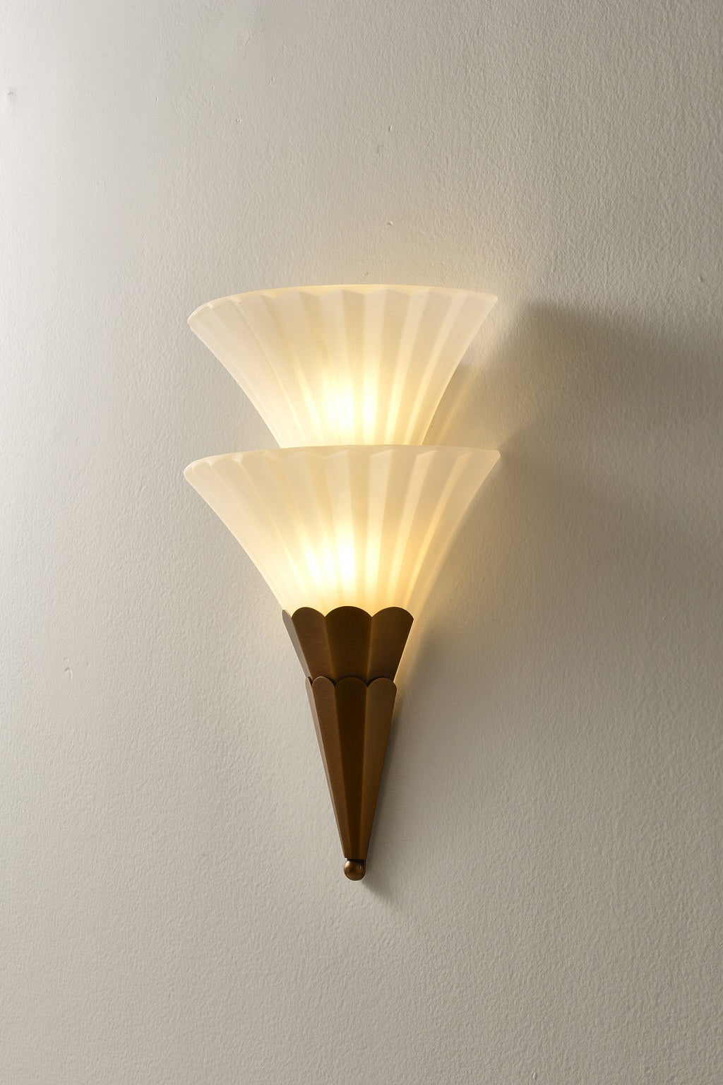 Fanelisse fluted glass wall sconce in Antique Bronze - Two-tier actual side view, warm light