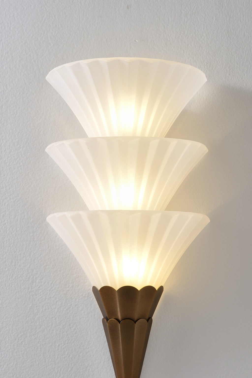 Fanelisse fluted glass wall sconce in Antique Bronze - Three-tier glass and metal body detail