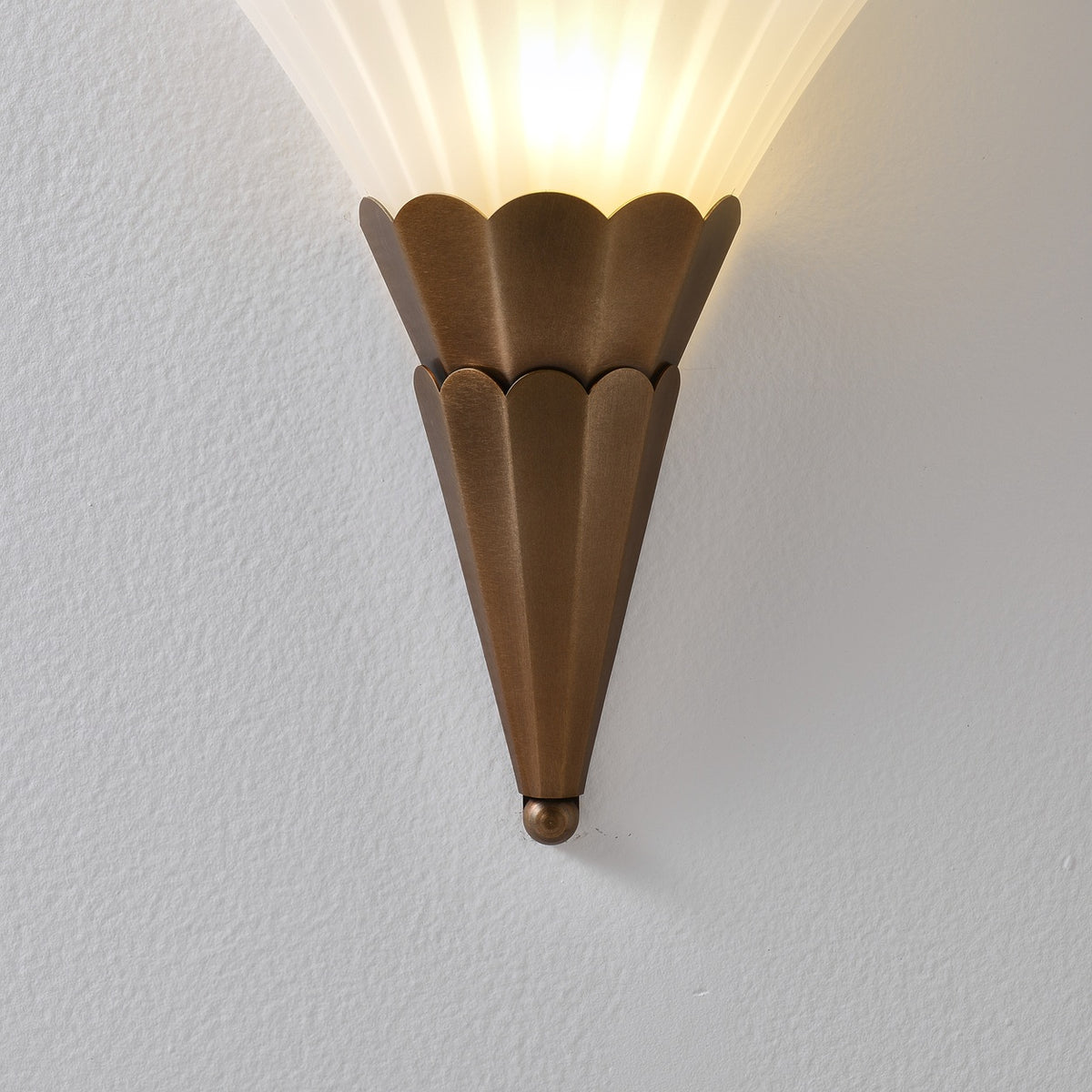 Fanelisse fluted glass wall sconce in Antique Bronze - Brushed Antique Bronze metal close-up