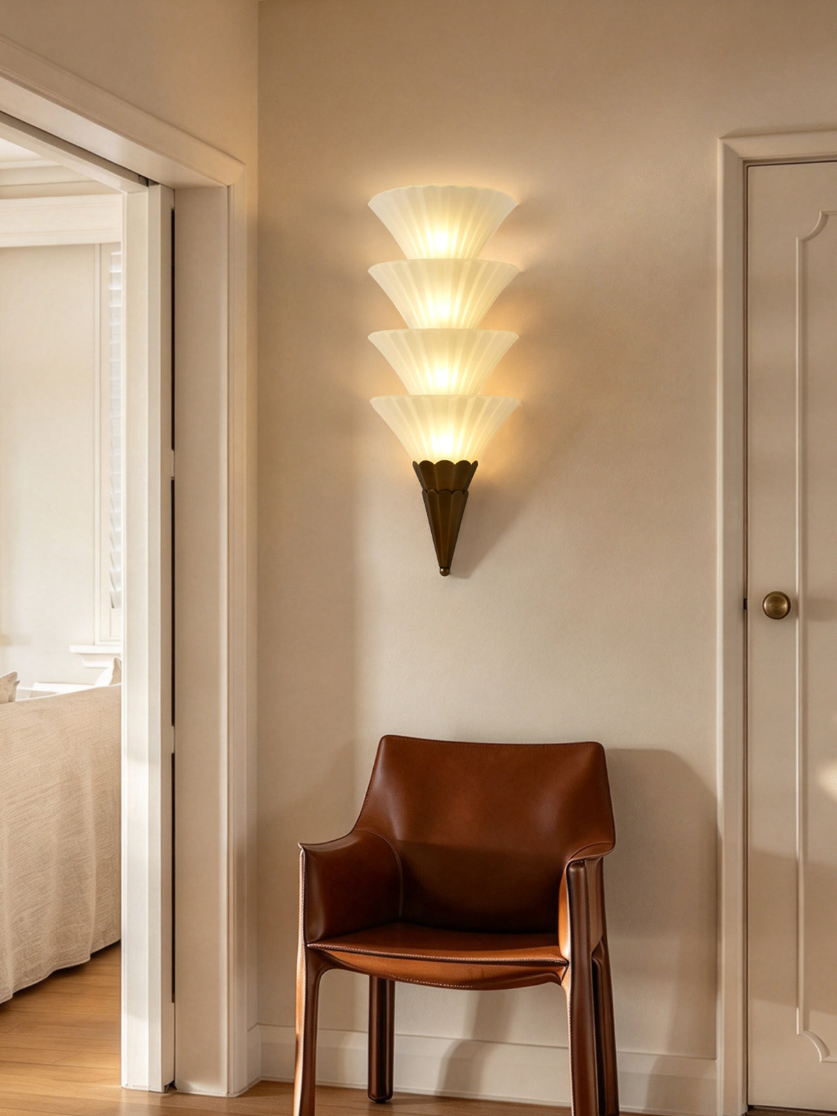 Fanelisse fluted glass wall sconce in Antique Bronze - Four-tier original lounge scene