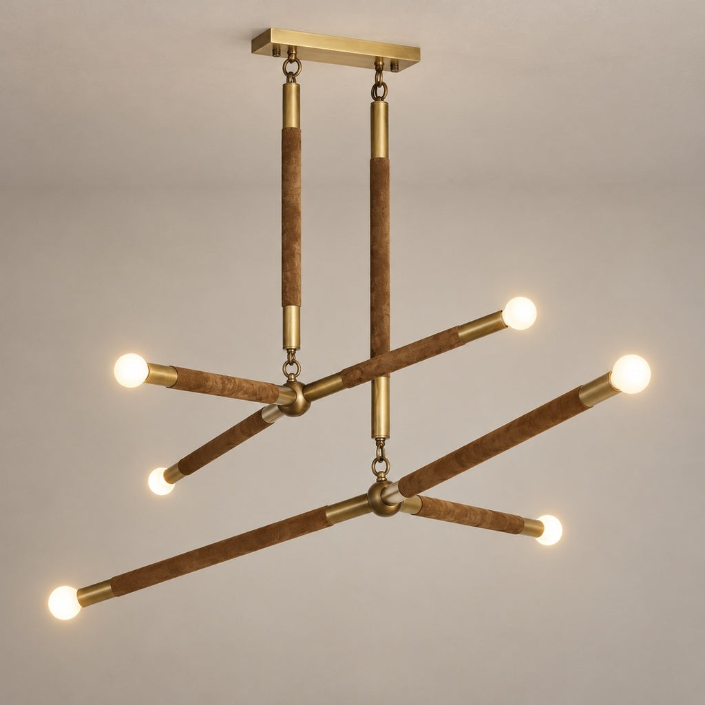 Arrow Double-Branch Suede Chandelier — Complete six-light brass and suede chandelier mounted against a taupe ceiling