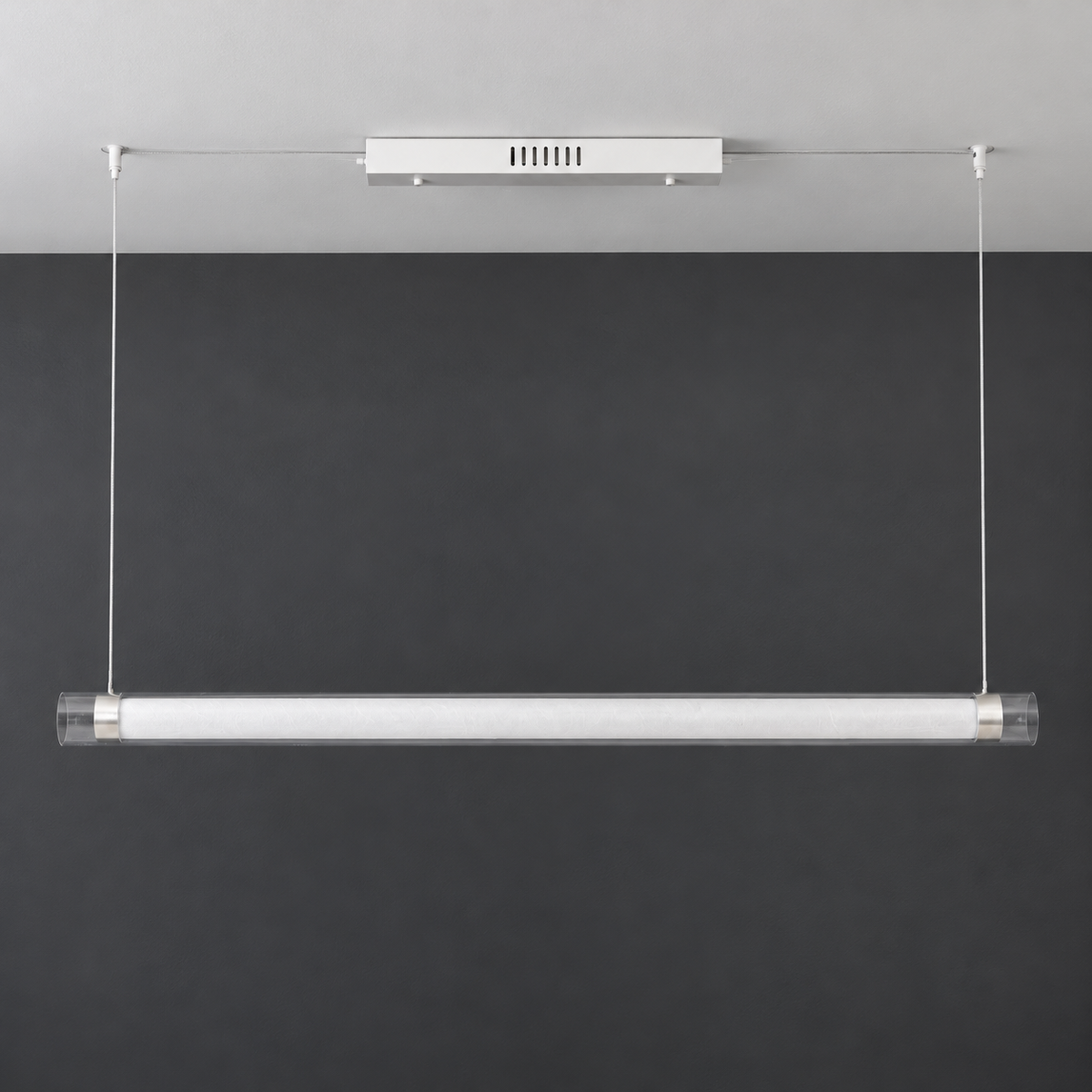 Unlit ivory diffuser and transparent tube ends on the white and silver pendant