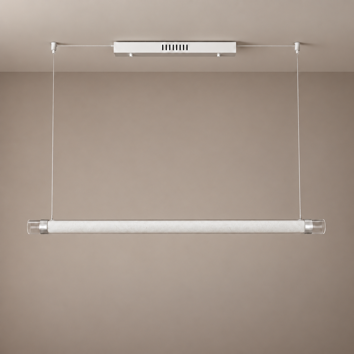 Unlit ivory tube pendant with a white canopy, silver fittings and transparent open ends, complete fixture against a taupe background
