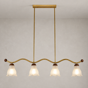 Cloveraine Fluted Petal Glass Linear Chandelier complete installed product view on a warm light background