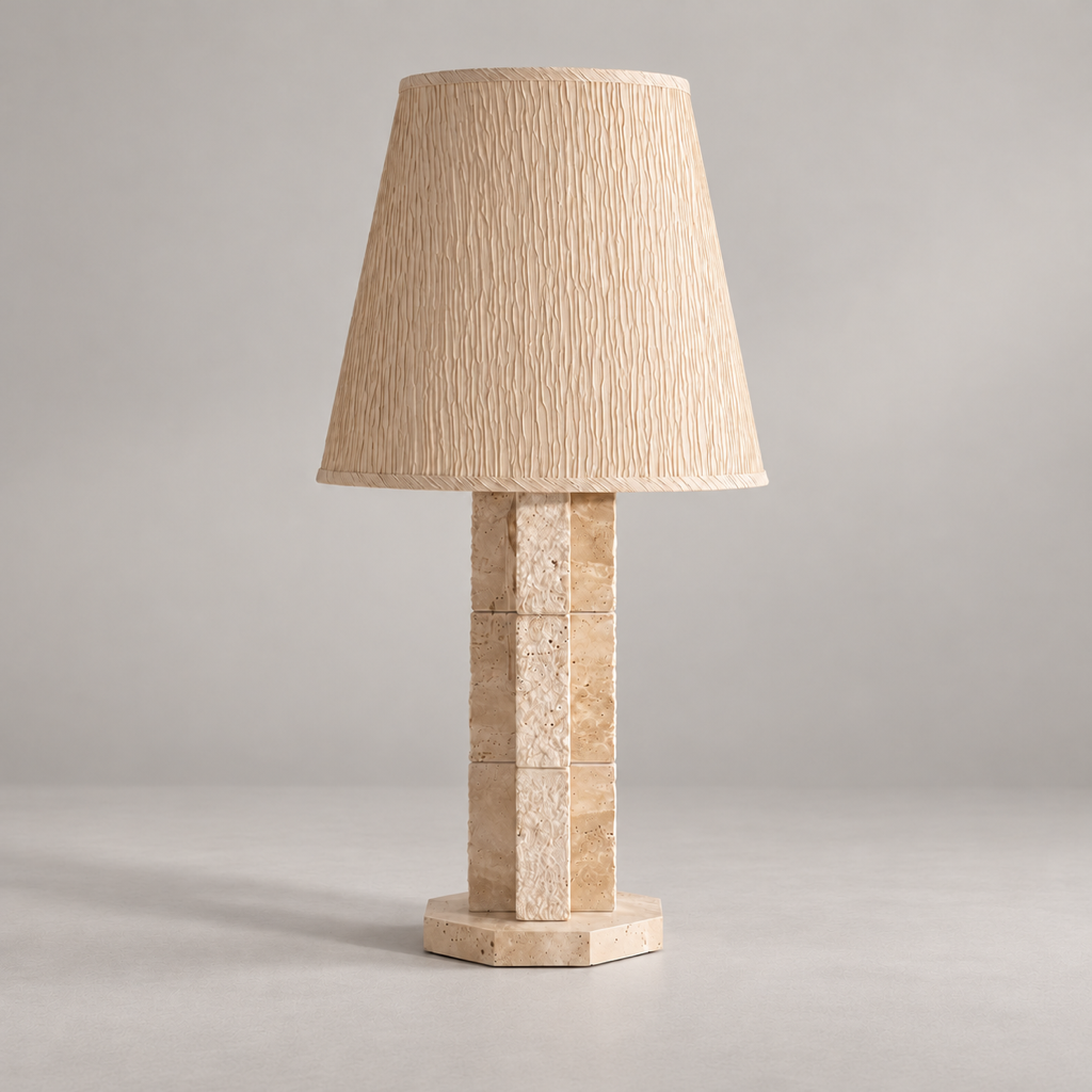 Hawksworth Travertine Table Lamp on a warm greige background; Hawksworth table / beige segmented stone / cream textured shade