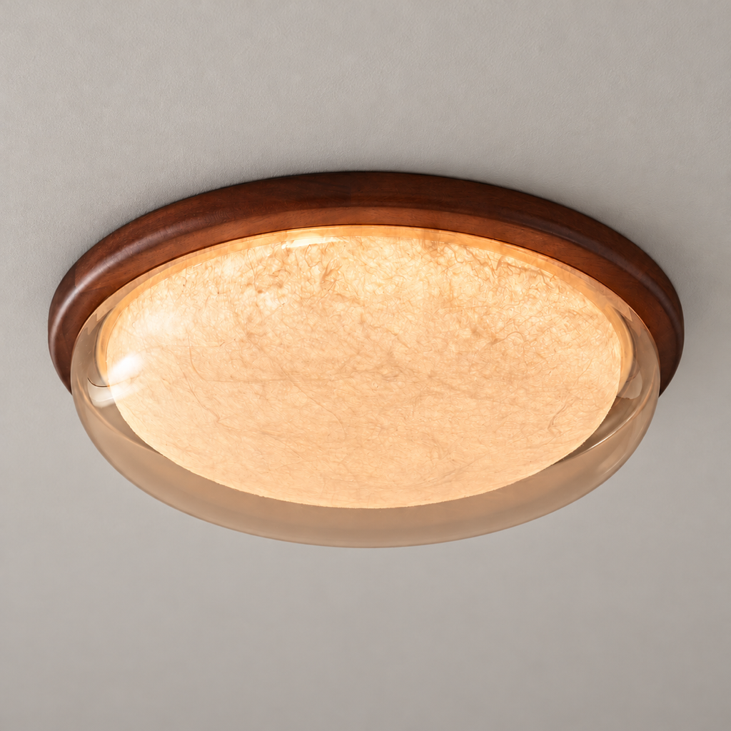 Sapelune Amber silk and sapele wood ceiling light illuminated against a neutral ceiling