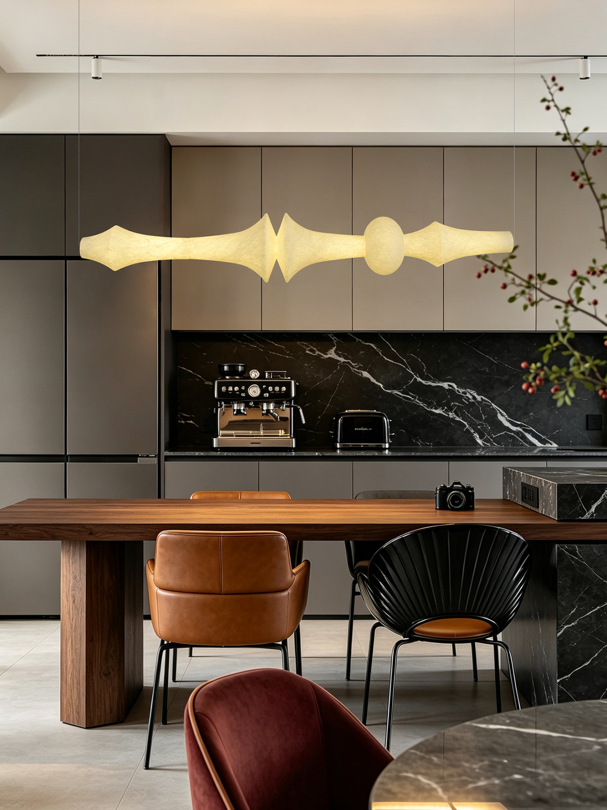 Orlithane linear pendant, Design F, illuminated over a walnut kitchen counter in the original interior scene.