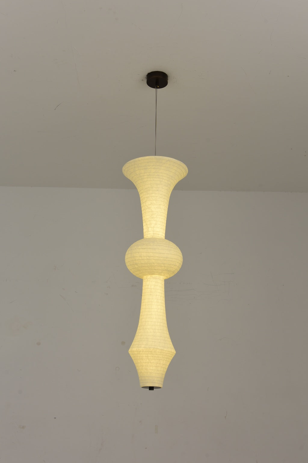 Orlithane design A sculptural mulberry silk pendant light, actual product photograph, light on