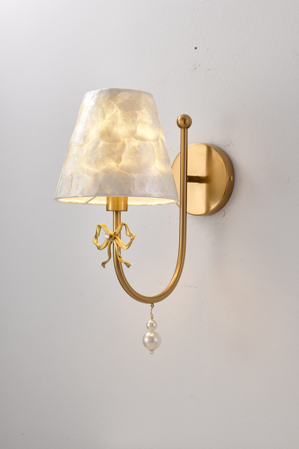 Rosnacre shell bow wall sconce - real on