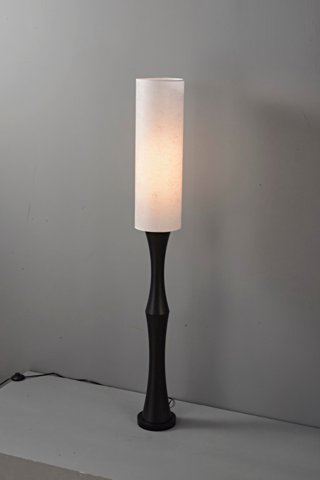 Tavrane black ash wood and fabric floor lamp, overall, light on