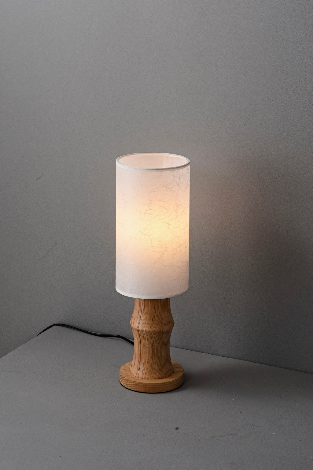 Tavrane natural ash wood and fabric table lamp, overall, light on