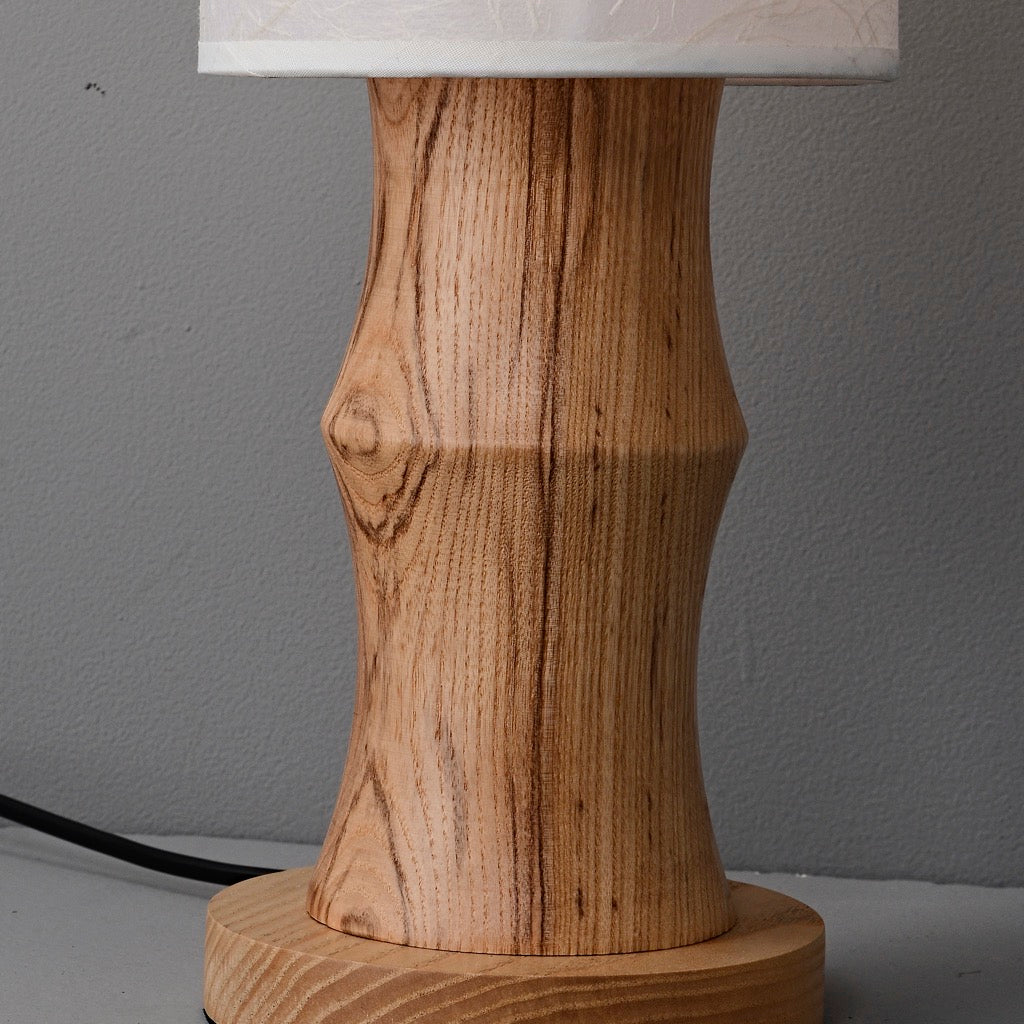 Tavrane natural ash wood and fabric table lamp, material detail, light off