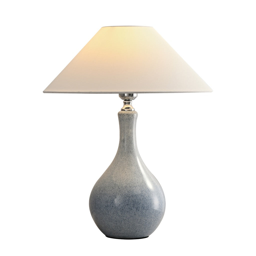 Complete mist-blue glazed ceramic table lamp with ivory fabric cone shade on a white background
