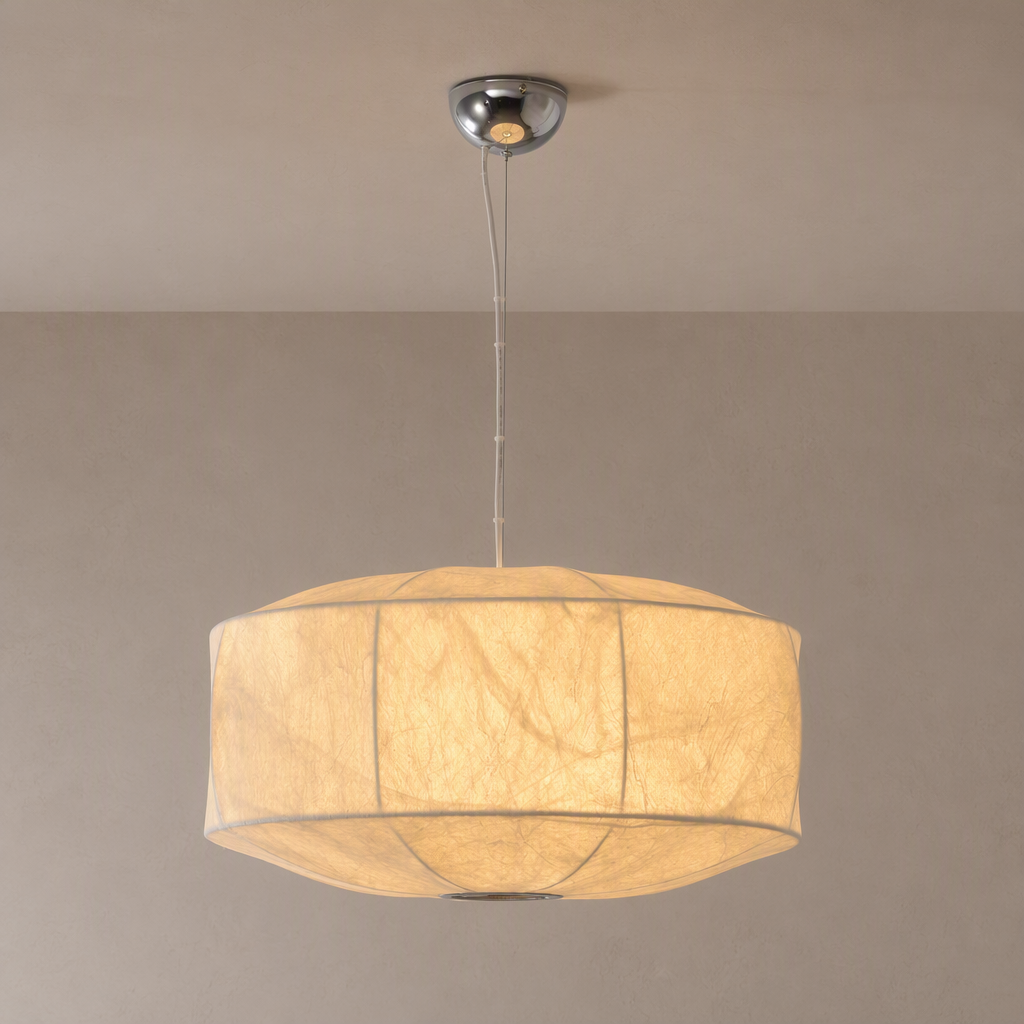 Natural mulberry silk drum pendant in white, warm light, complete suspension against taupe background