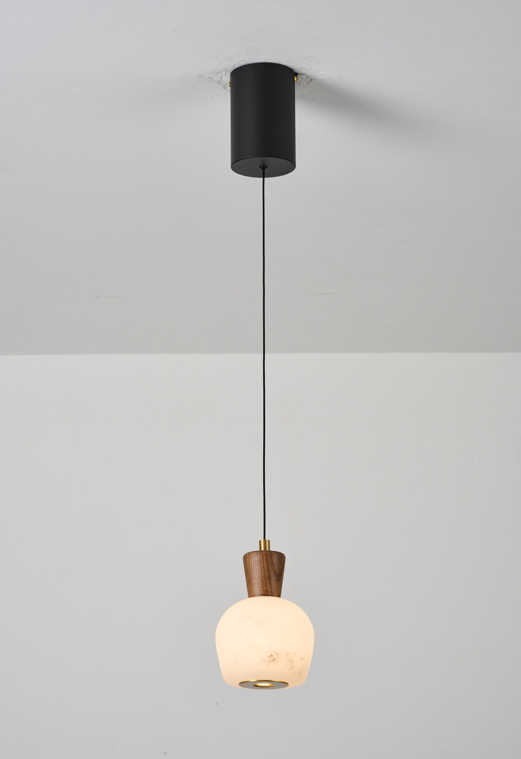 Ashalune Style A alabaster pendant, lights on