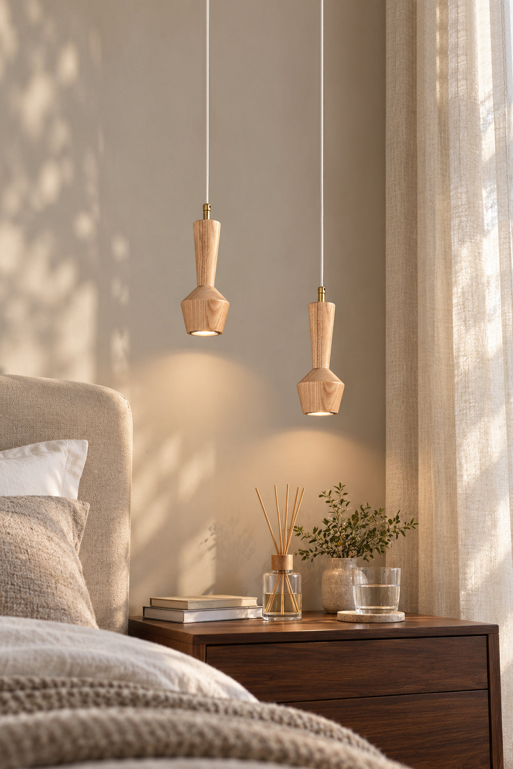 Two individual ash wood pendants in a bedside scene; pendants are sold separately