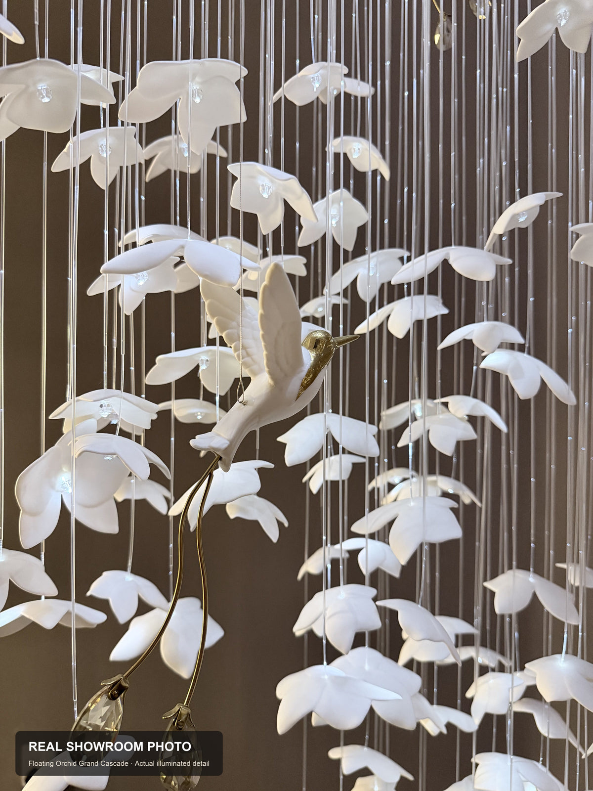 Floating Orchid Ceramic Grand Cascade Chandelier — real showroom photo, alternate ceramic bird and crystal drop detail