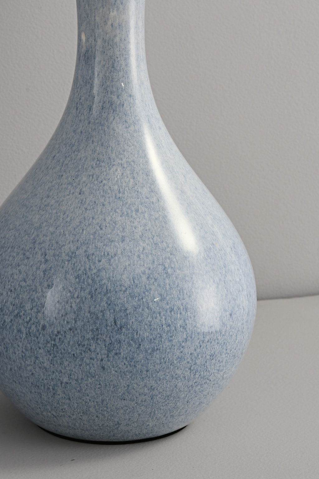 Close view of the blue ceramic glaze on the Mist-Blue table lamp