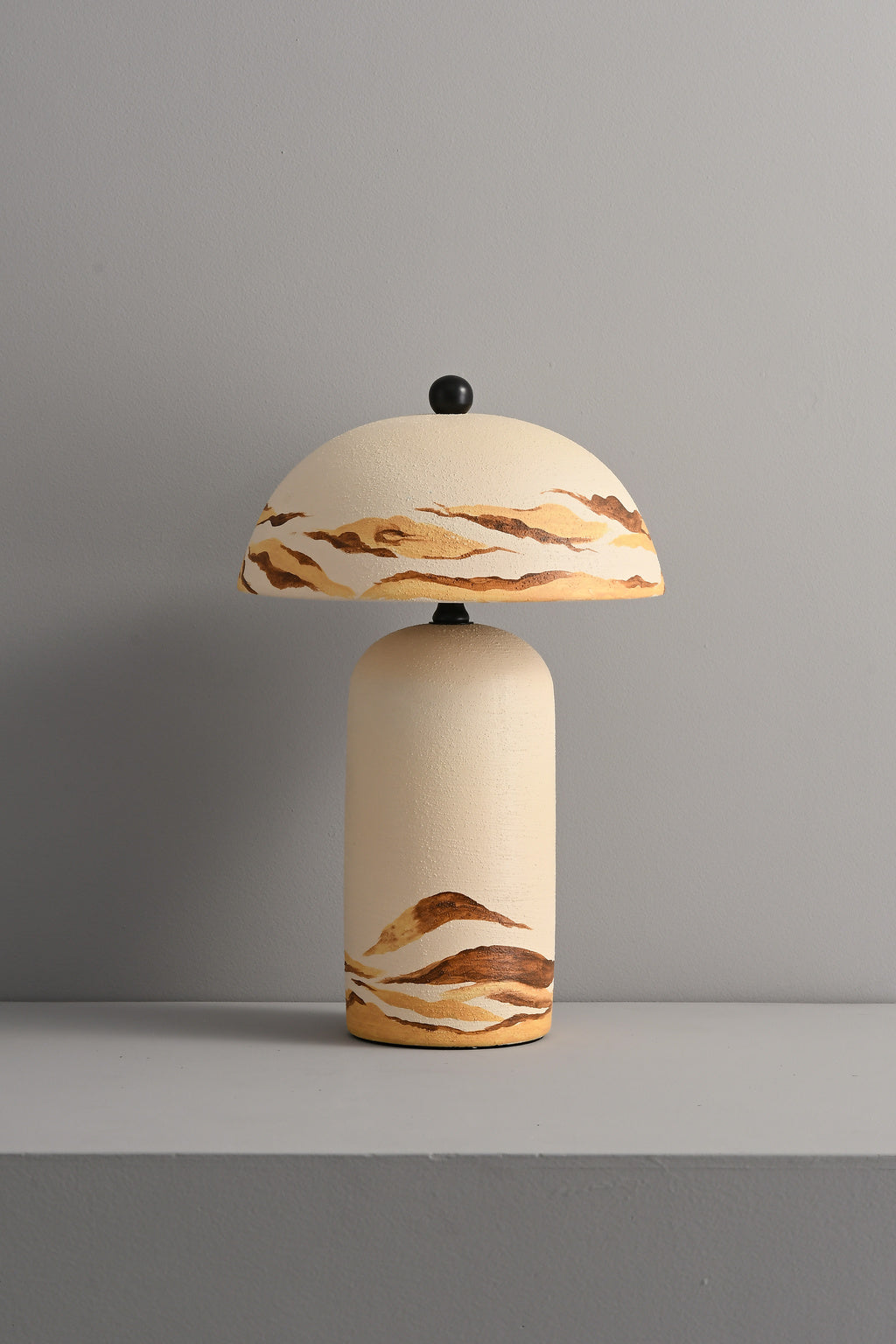 Desert Ivory hand-painted ceramic table lamp unlit in a real room