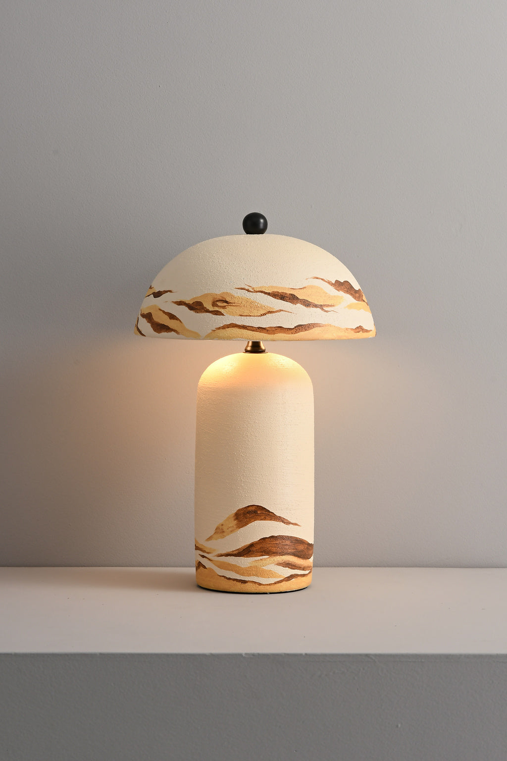 Desert Ivory ceramic table lamp lit front view