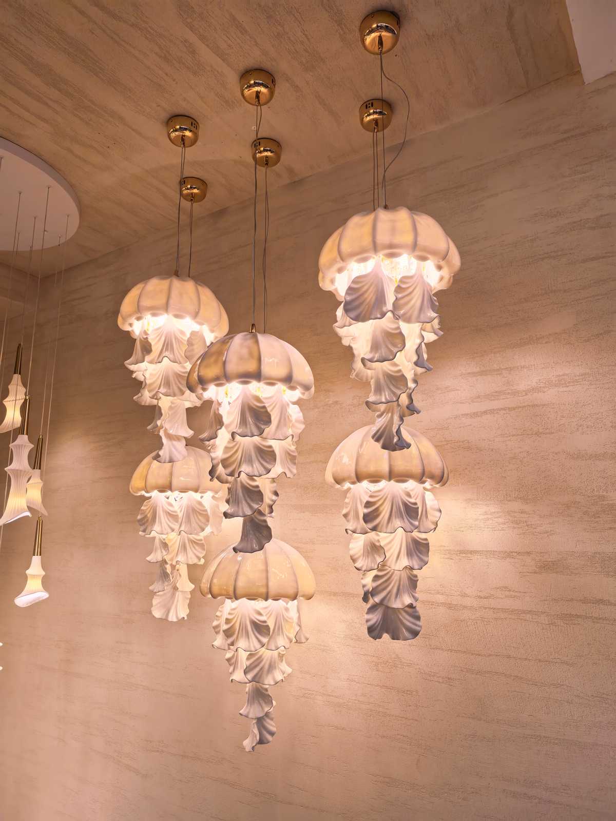 Ondelisse Ivory Jellyfish Pendant Light — original showroom photograph of independently suspended fixtures, angle one
