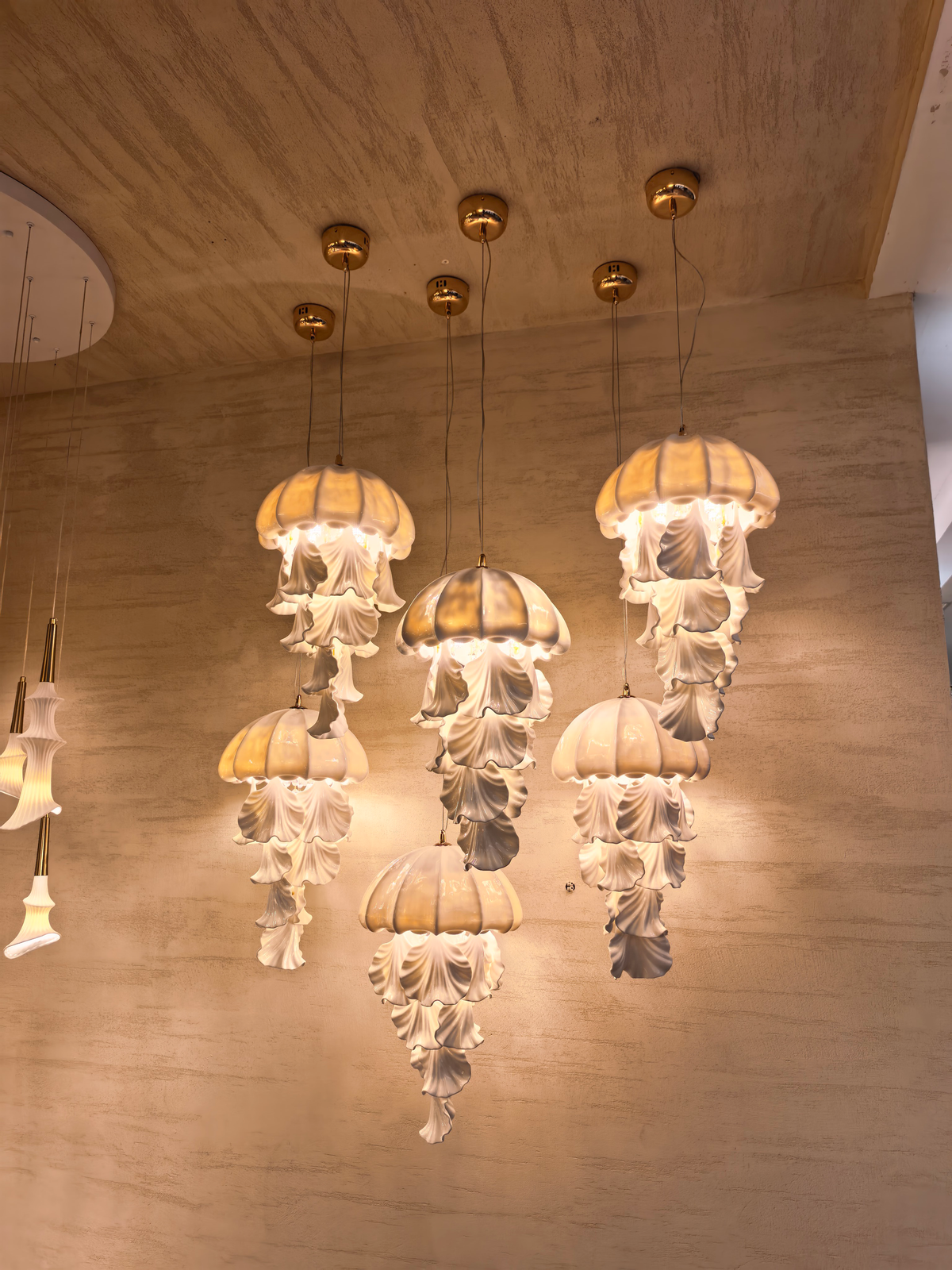 Ondelisse Ivory Jellyfish Pendant Light — original showroom photograph of independently suspended fixtures, angle three