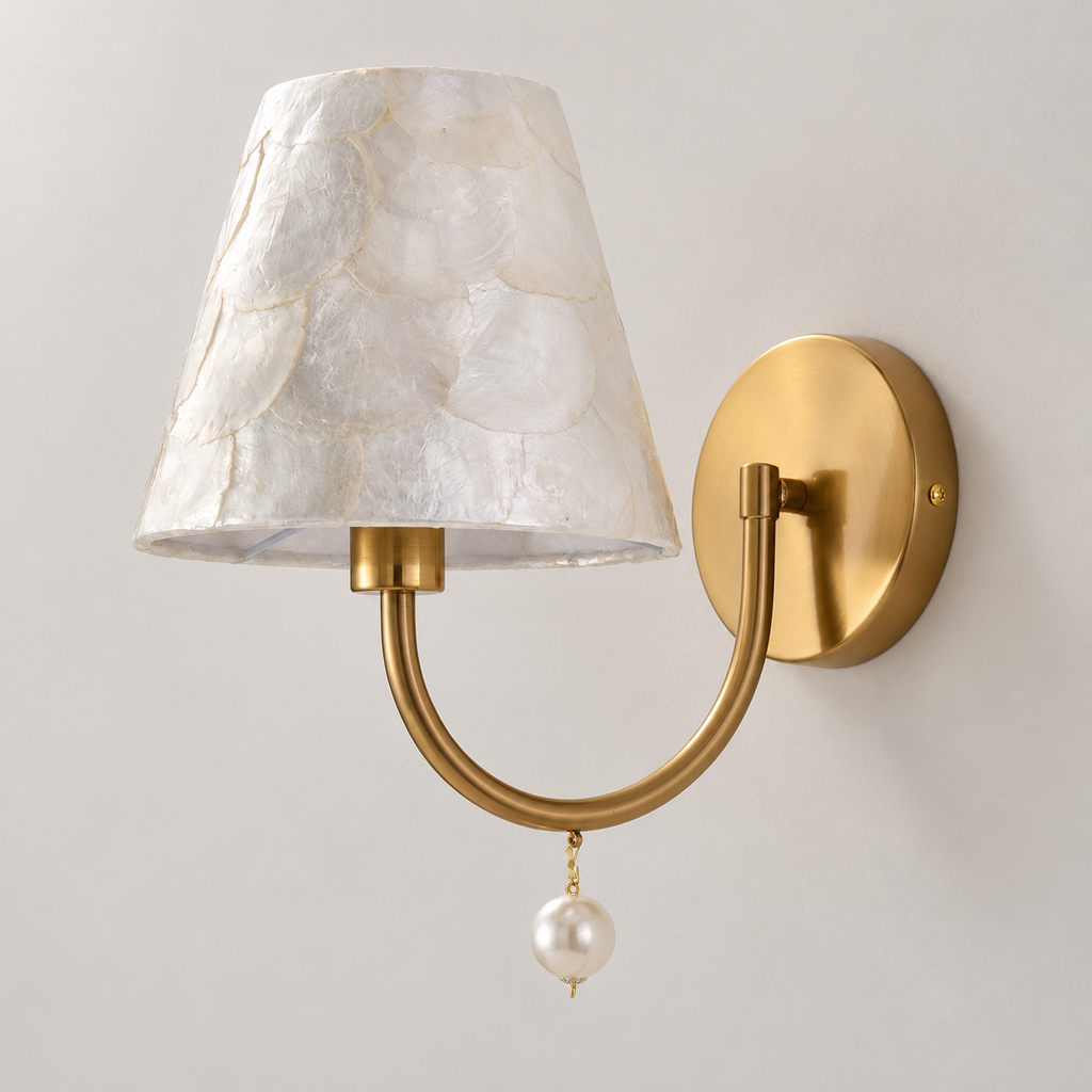 Orelvienne natural shell wall sconce with gold-tone U-shaped arm and pearl-like drop, light off