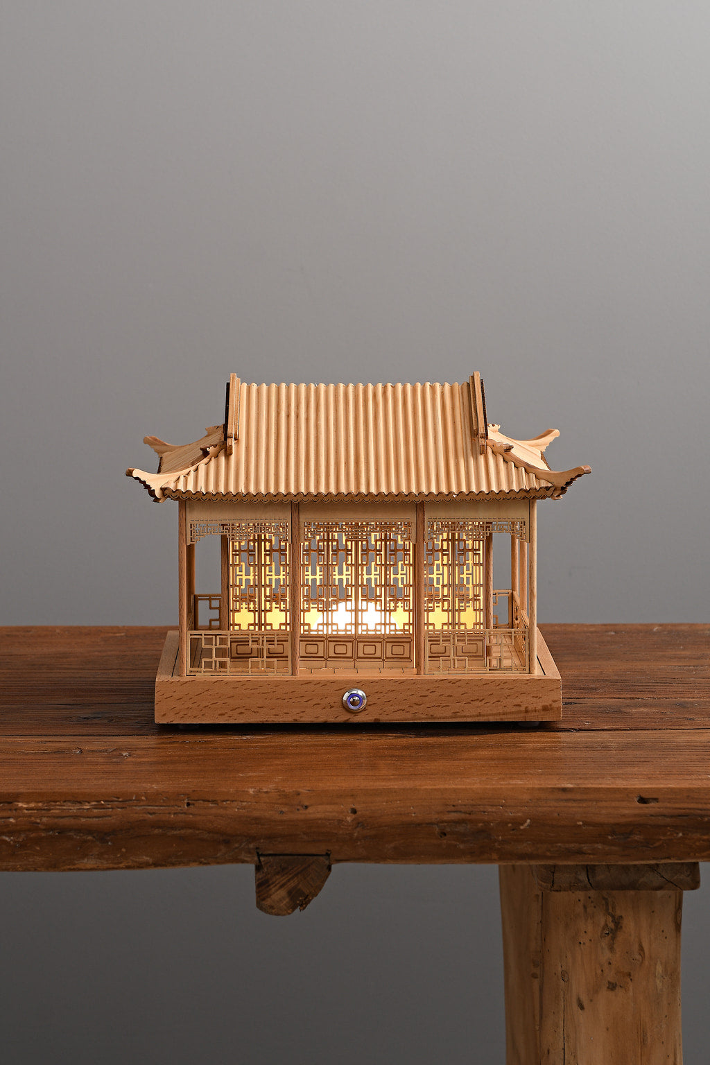 Pavilume Rain Pavilion pine table lamp illuminated