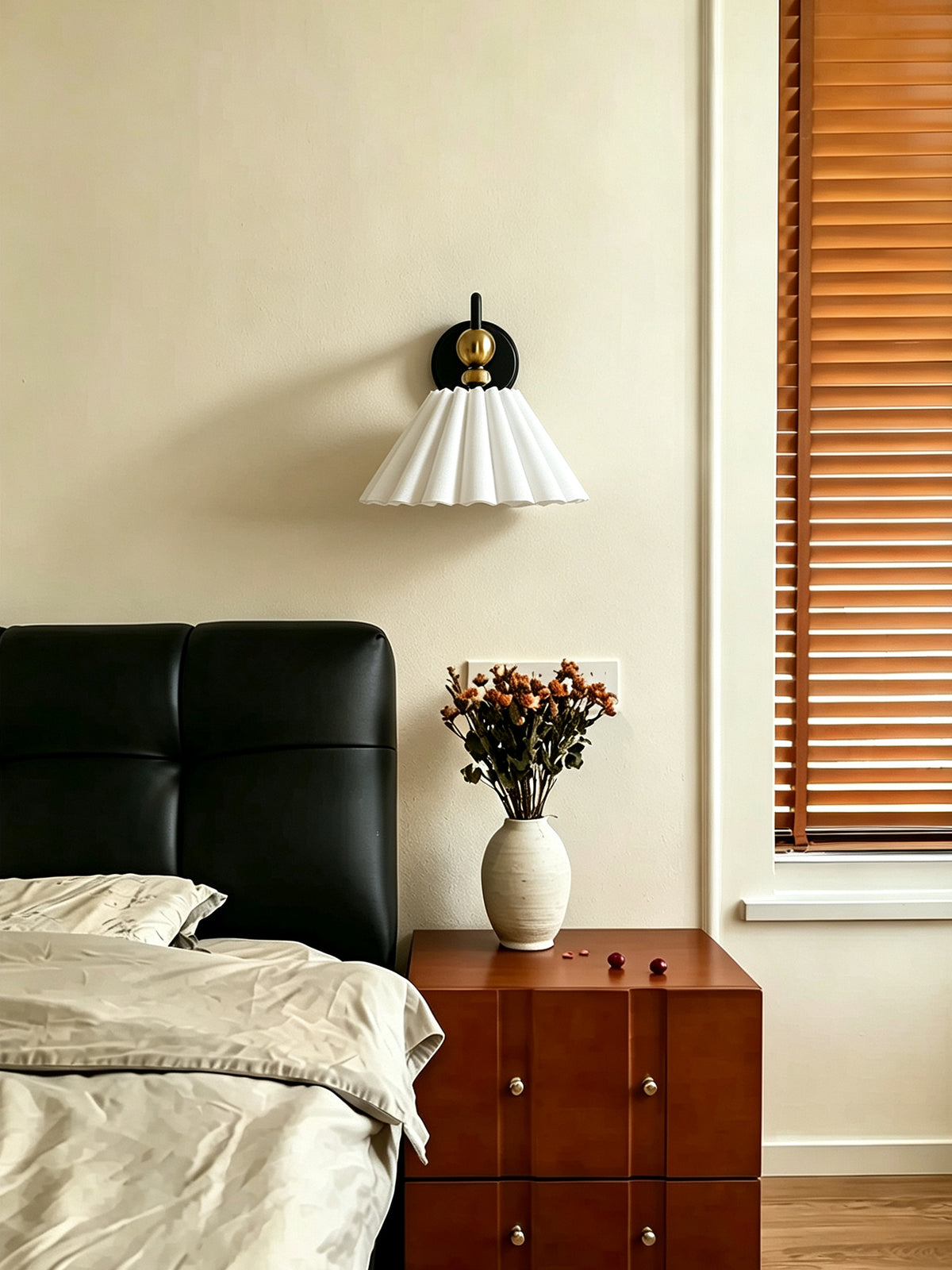 Unlit fabric wall sconce in a bedroom setting