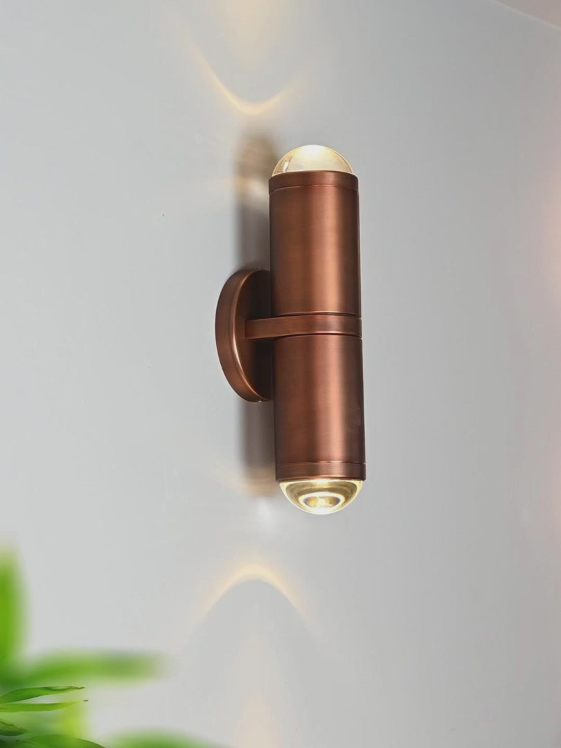 Load video: Modern Crystal Glass Cylinder Wall Sconce in Vintage Bronze - product gallery video