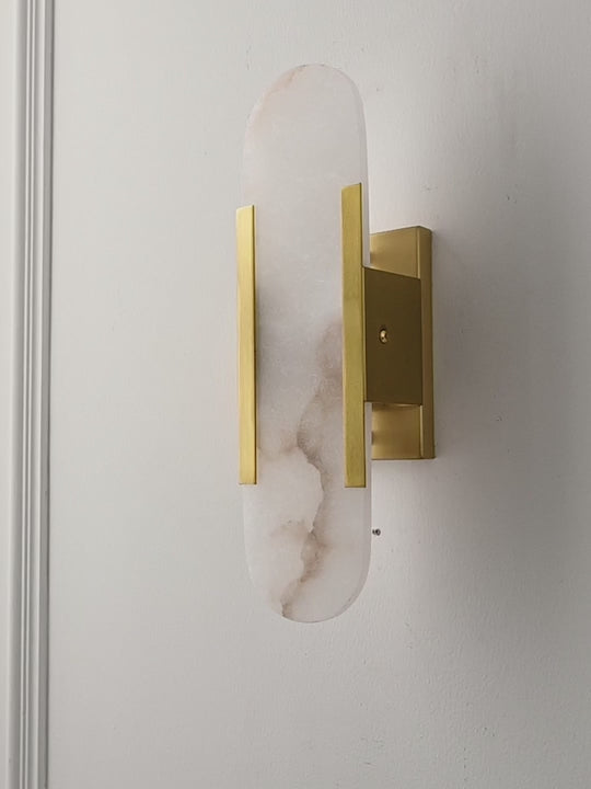Load video: Modern Alabaster Capsule Wall Sconce - product gallery video
