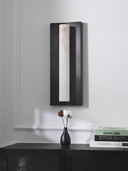 Load video: Linear Alabaster Wall Sconce in Brushed Black - product gallery video