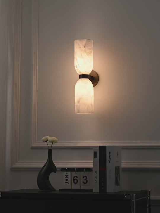 Load video: Modern Alabaster Cylinder Wall Sconce in Antique Brass - product gallery video