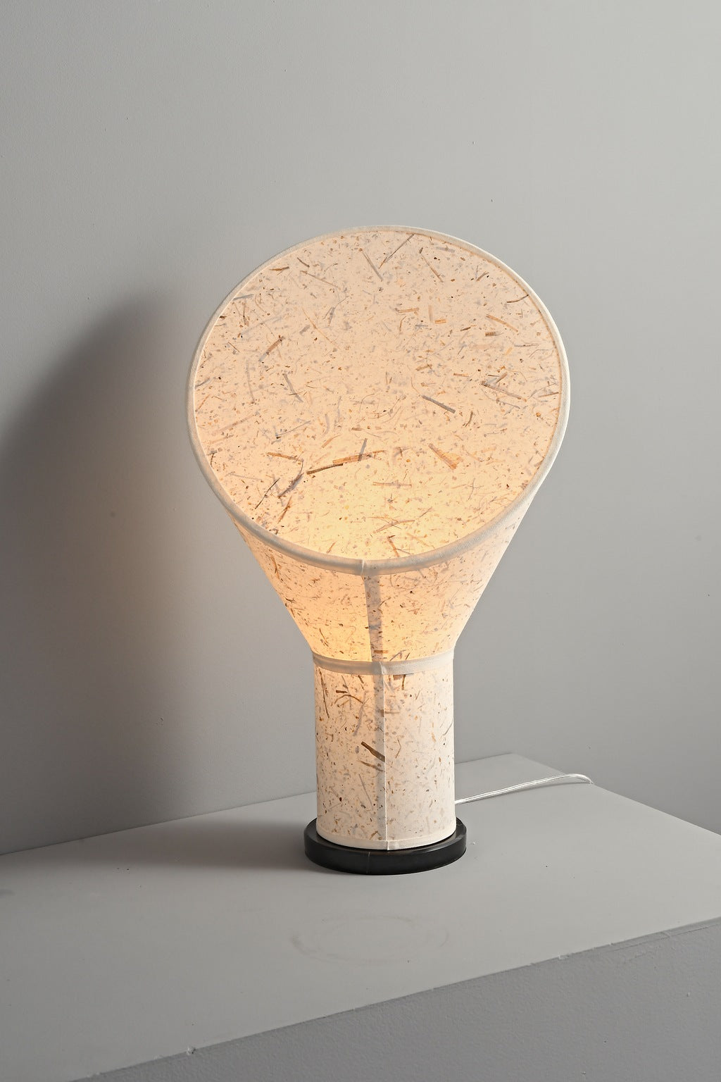 Serevane sculptural paper table lamp lit in the real studio