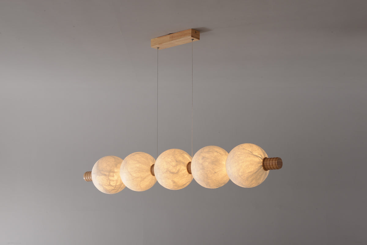 5-globe horizontal natural mulberry silk pendant with light wood details, real product photograph