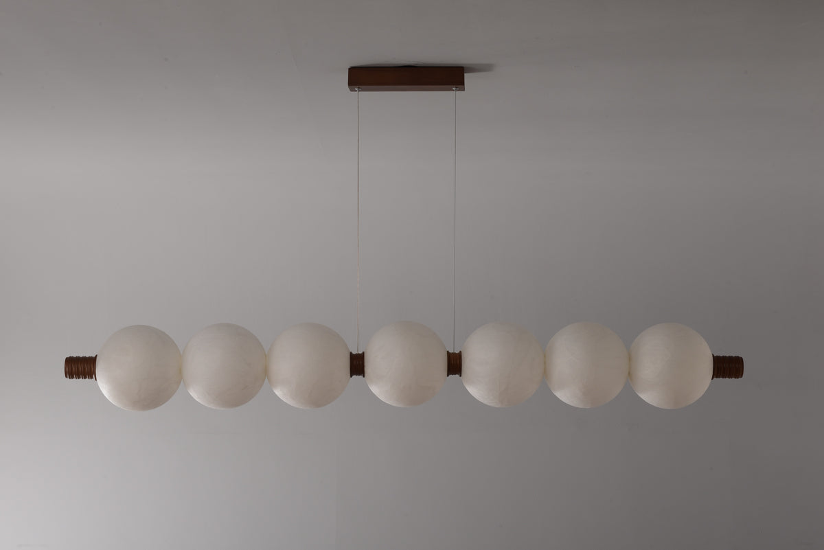 7-globe horizontal natural mulberry silk pendant with dark wood details, real product photograph